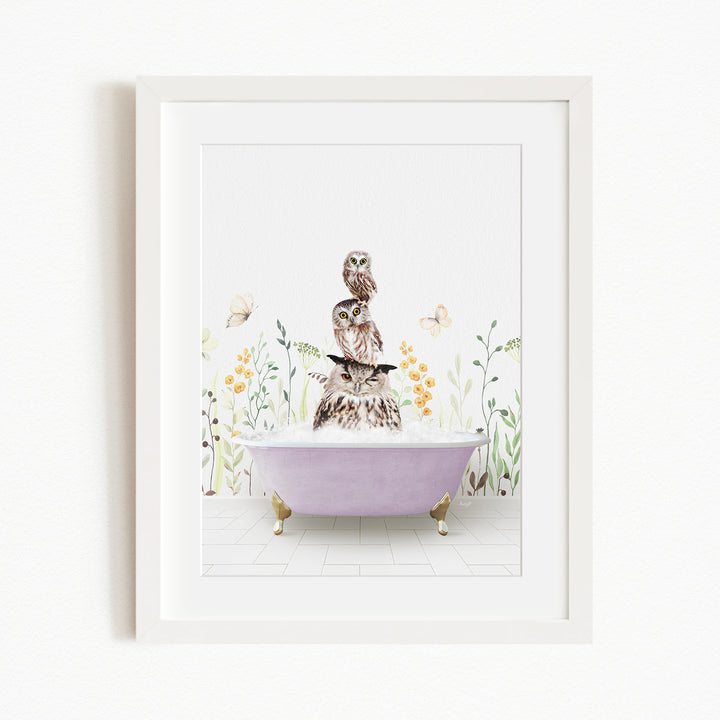 A framed print depicting a whimsical scene of a cat sitting in a bathtub, surrounded by flowers and butterflies.