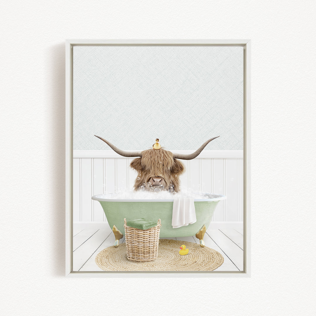 A brown cow with large horns is sitting in a green bathtub filled with bubbles, surrounded by a basket of toys and a yellow rubber duck.