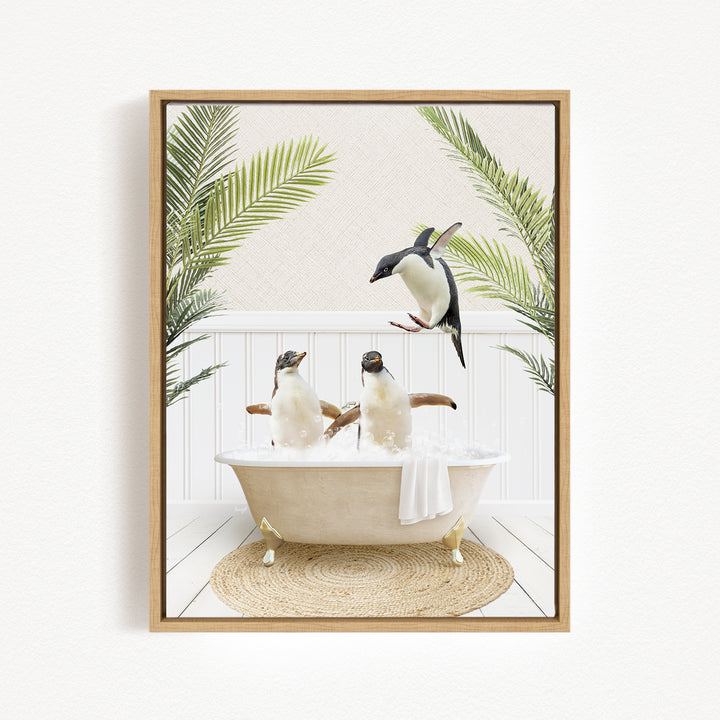 A framed image depicting three penguins sitting in a bathtub, surrounded by palm leaves, creating a whimsical and playful scene.