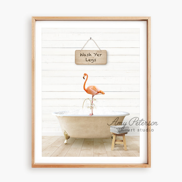 a flamingo standing on a bathtub with a sign hanging above it