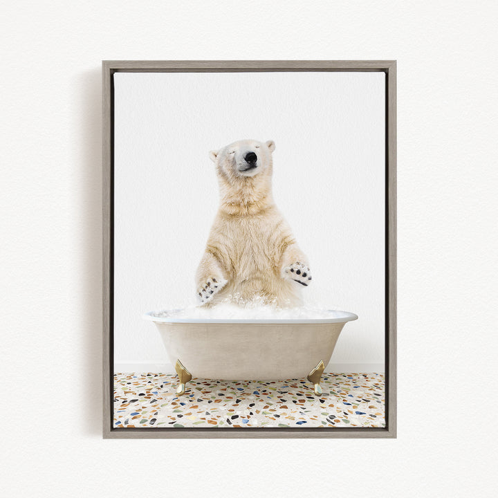 A polar bear standing in a bathtub filled with water, with its paws submerged in the water.