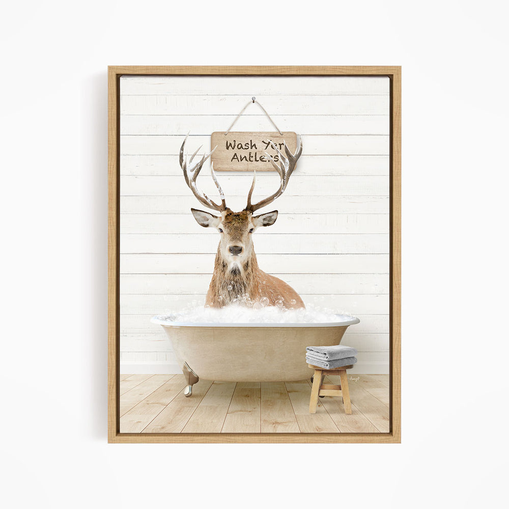 A deer with antlers is sitting in a bathtub, with a sign above it that says "Wash your antlers".