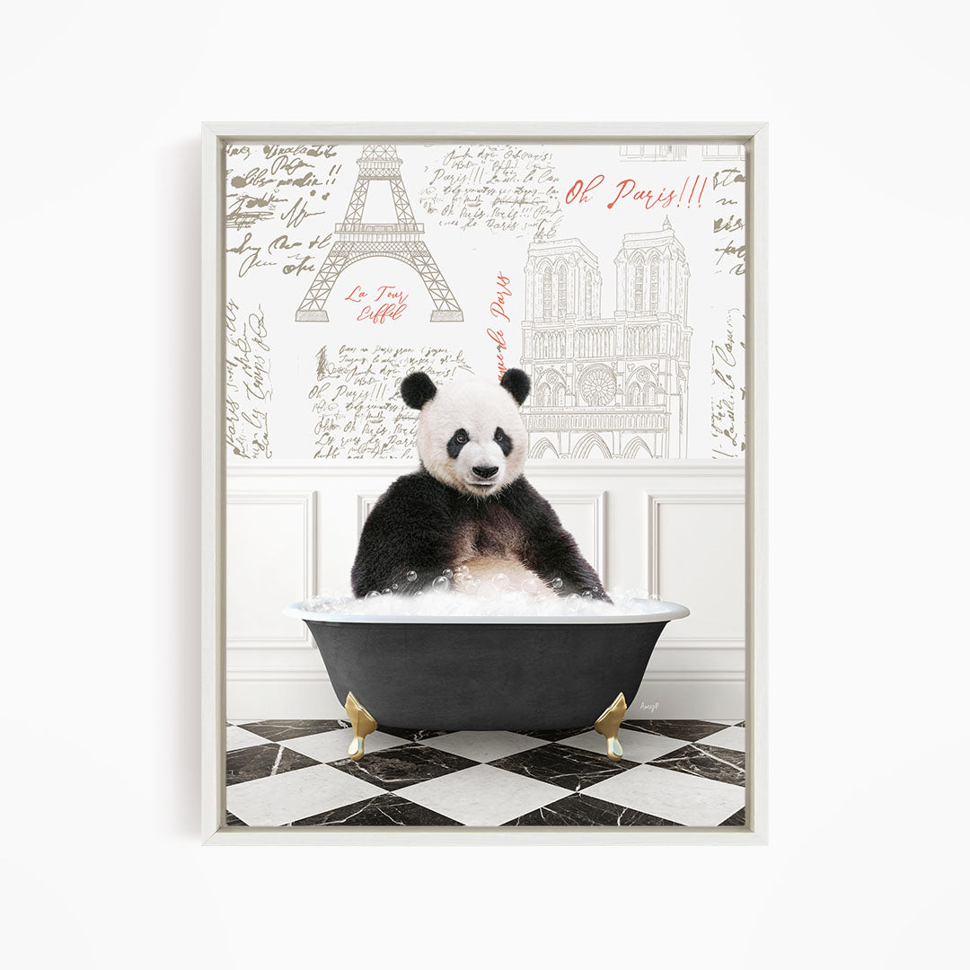 A panda bear sitting in a bathtub filled with bubbles, surrounded by a wall with various inscriptions and illustrations, including the Eiffel Tower.
