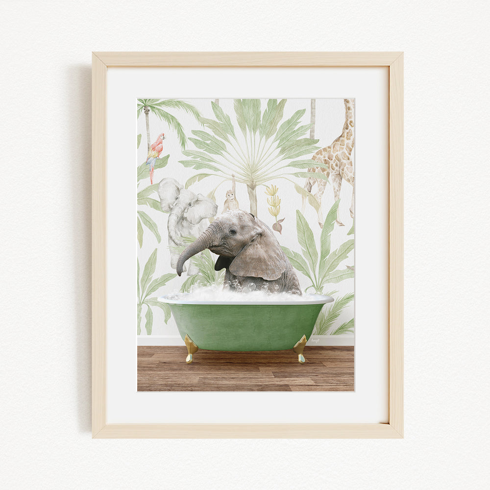A framed image depicting a baby elephant sitting in a green bathtub, surrounded by tropical foliage and other animals.