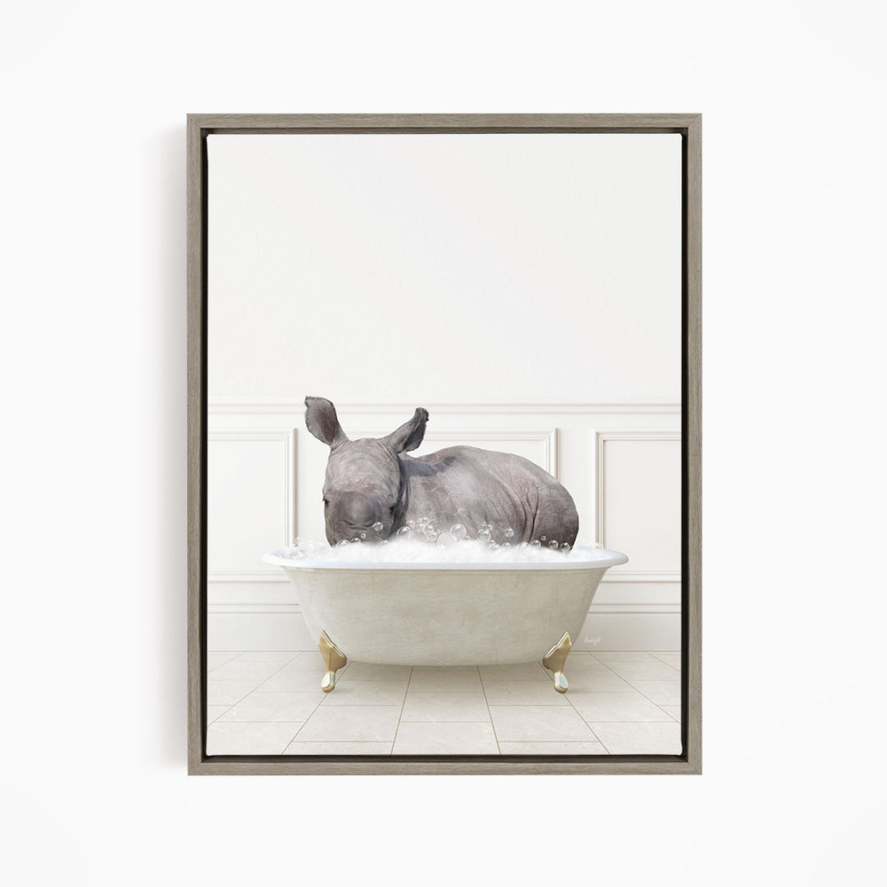 A rhinoceros is sitting in a bathtub filled with water, creating a whimsical and playful scene.