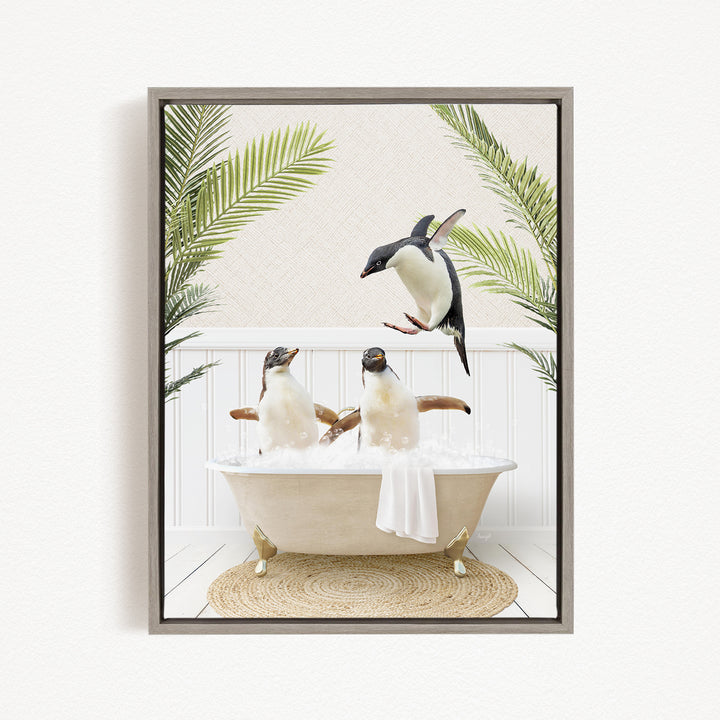 A framed image depicting two penguins sitting in a bathtub, surrounded by palm leaves, with one penguin flying towards the bathtub.