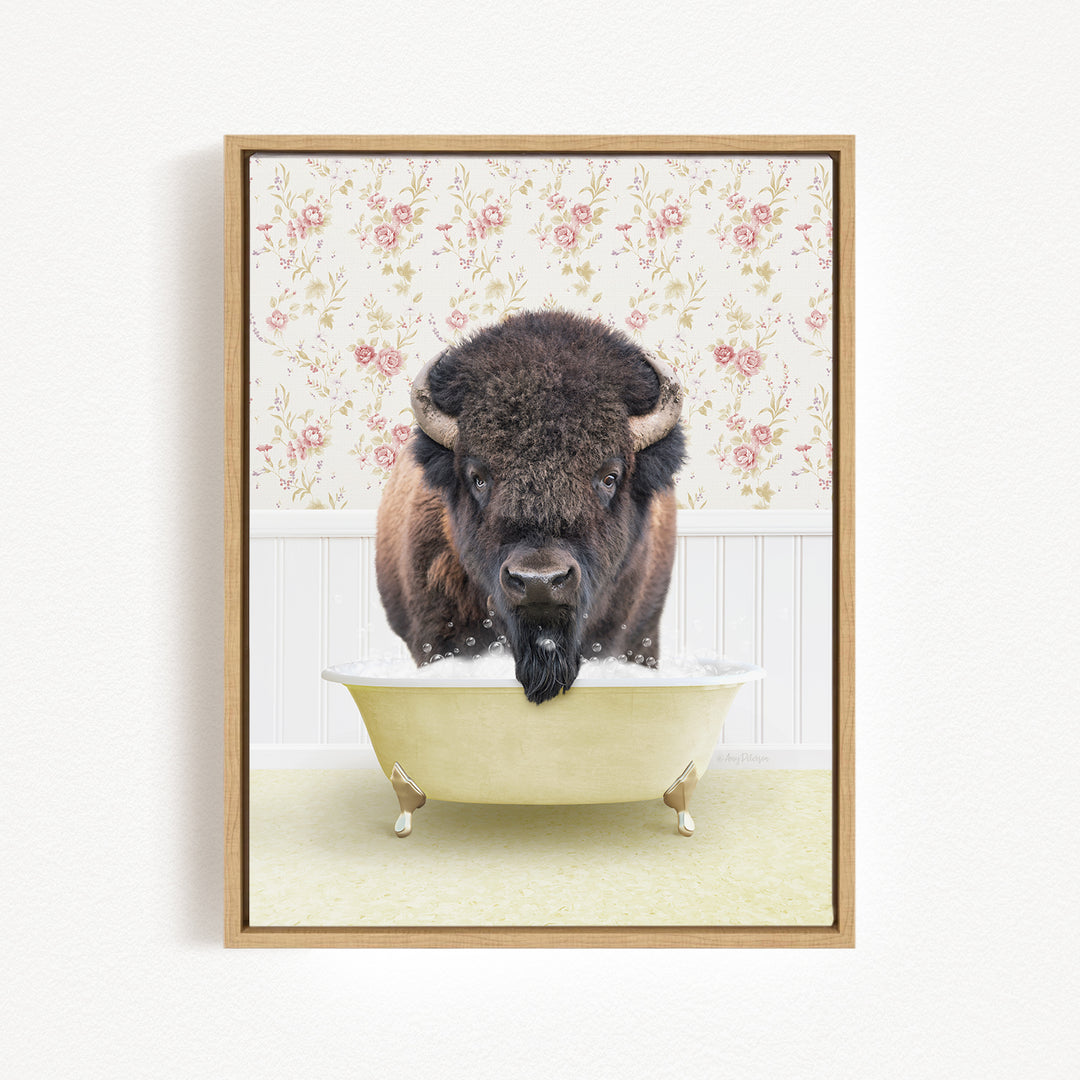 A buffalo is sitting in a bathtub filled with water, surrounded by a floral wallpaper.