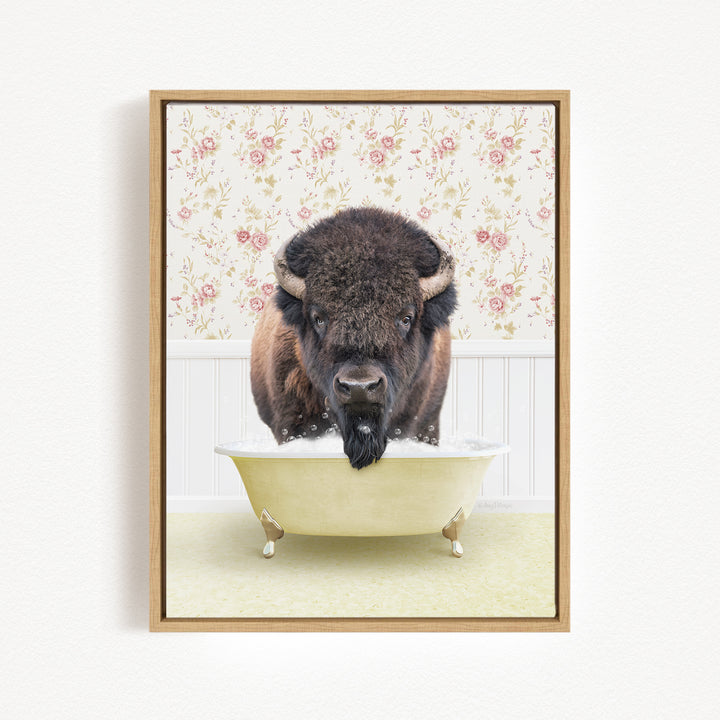 A buffalo is sitting in a bathtub filled with water, surrounded by a floral wallpaper.