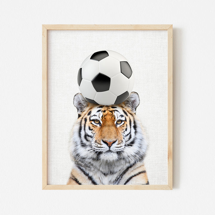 a picture of a tiger with a soccer ball on its head