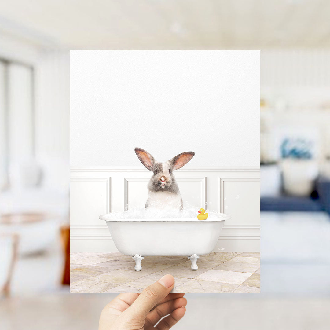 A white rabbit sitting in a bathtub filled with water, with a yellow rubber duck floating nearby.