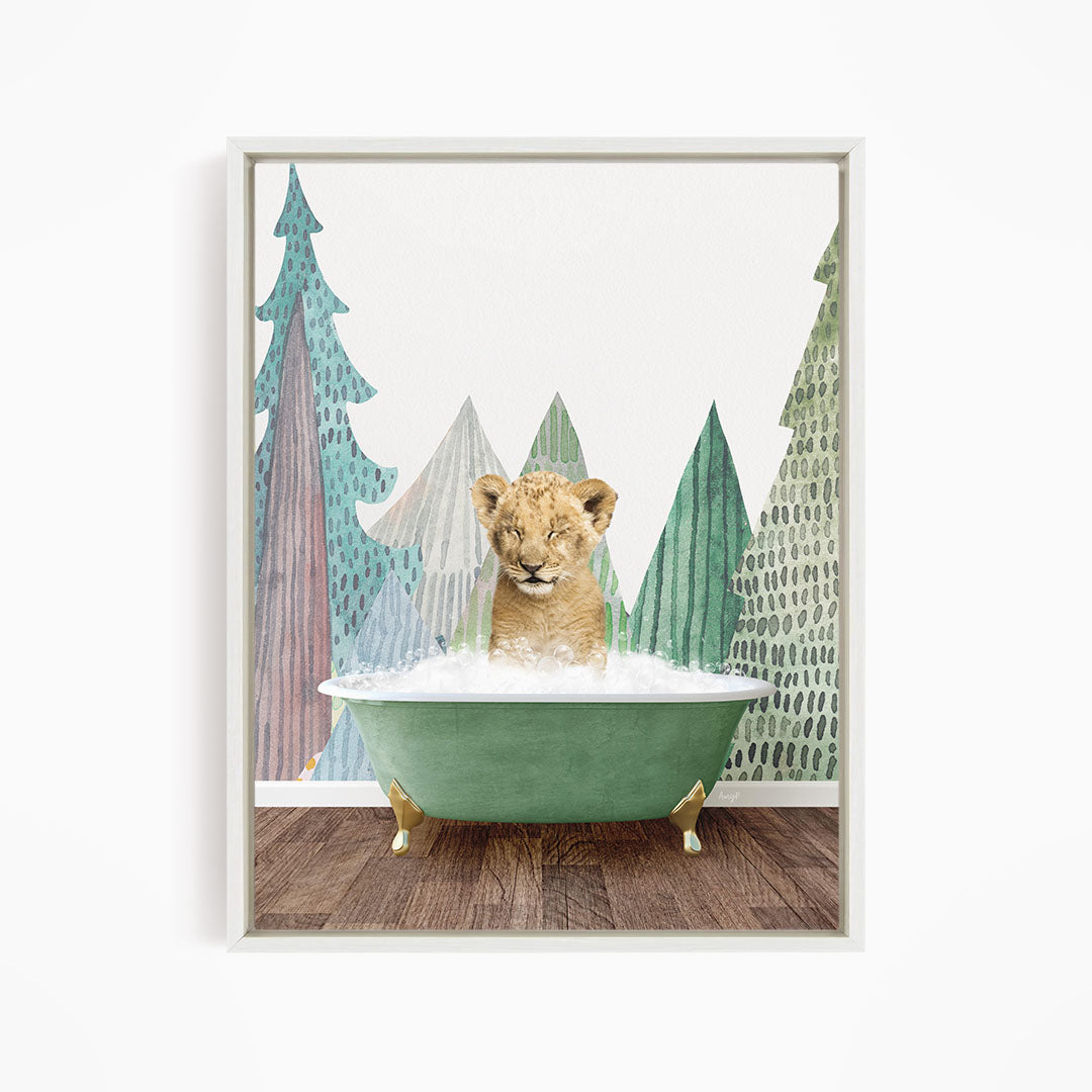 A young lion cub is sitting in a green bathtub, surrounded by a forest-themed background with trees and foliage.
