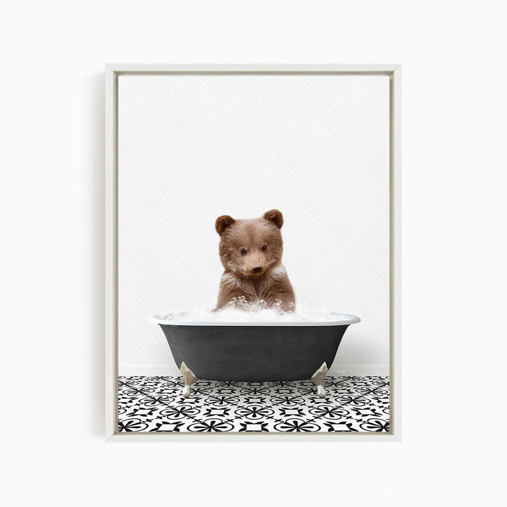 A cute brown bear sitting in a black bathtub filled with water, surrounded by a black and white patterned floor.