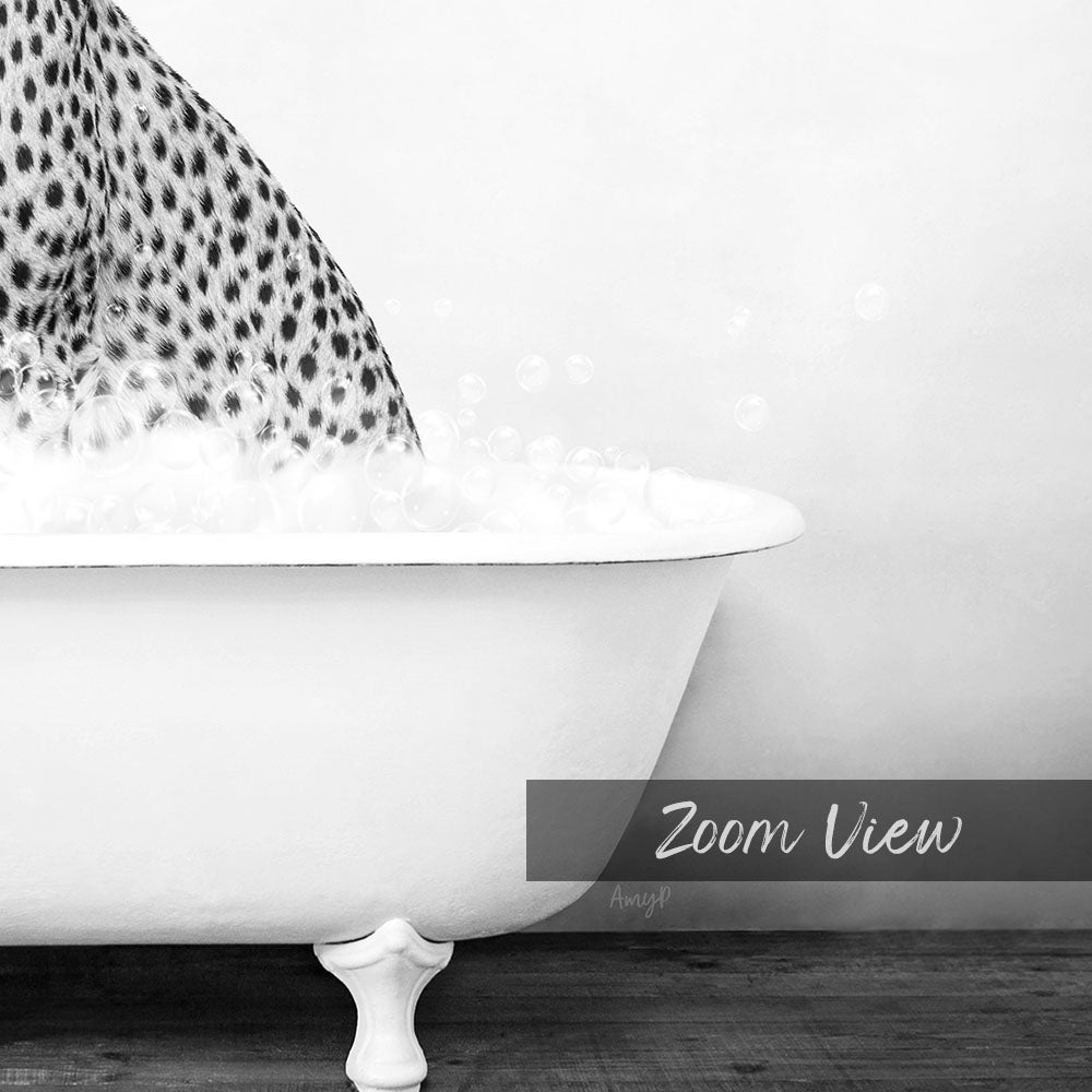 A close-up black and white image of a bathtub filled with water and bubbles, with a leopard print pattern on the tub.