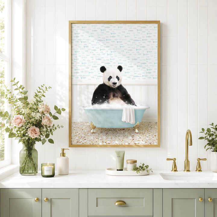 A framed image of a panda sitting in a bathtub, surrounded by a floral arrangement and various bathroom accessories, such as a soap dispenser and a candle.