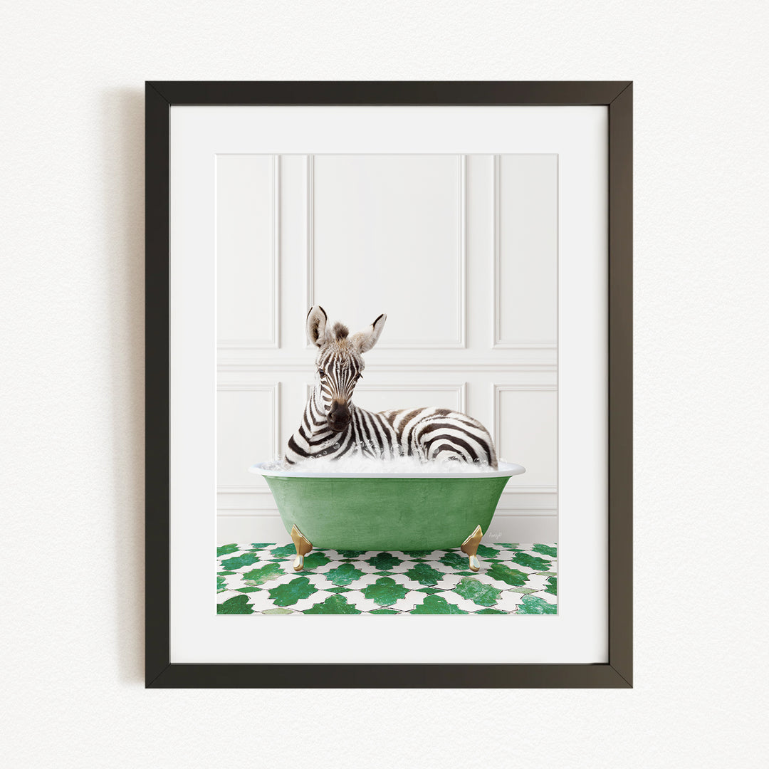 A zebra is sitting in a green bathtub, surrounded by a patterned green and white rug.