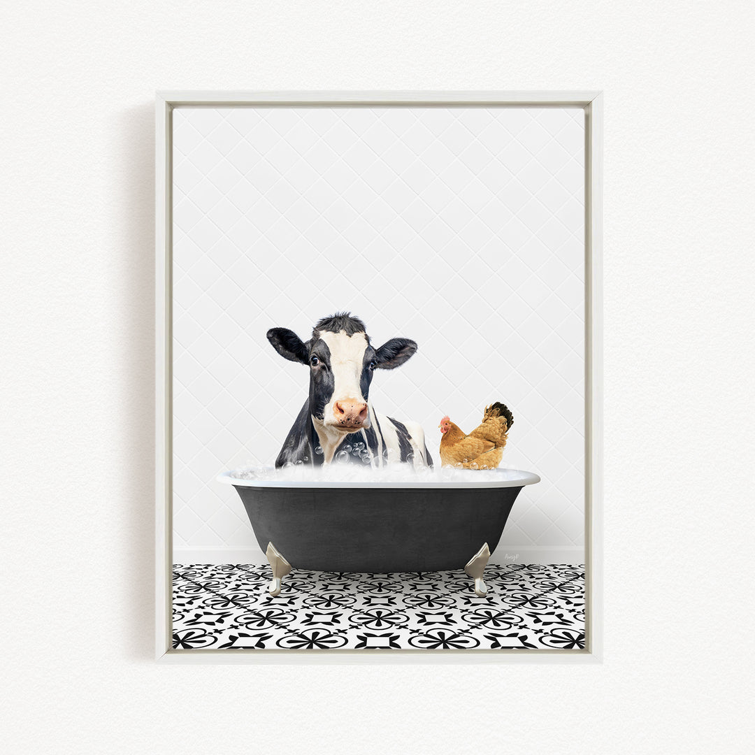 A black and white cow is sitting in a bathtub filled with water, with a chicken standing nearby.
