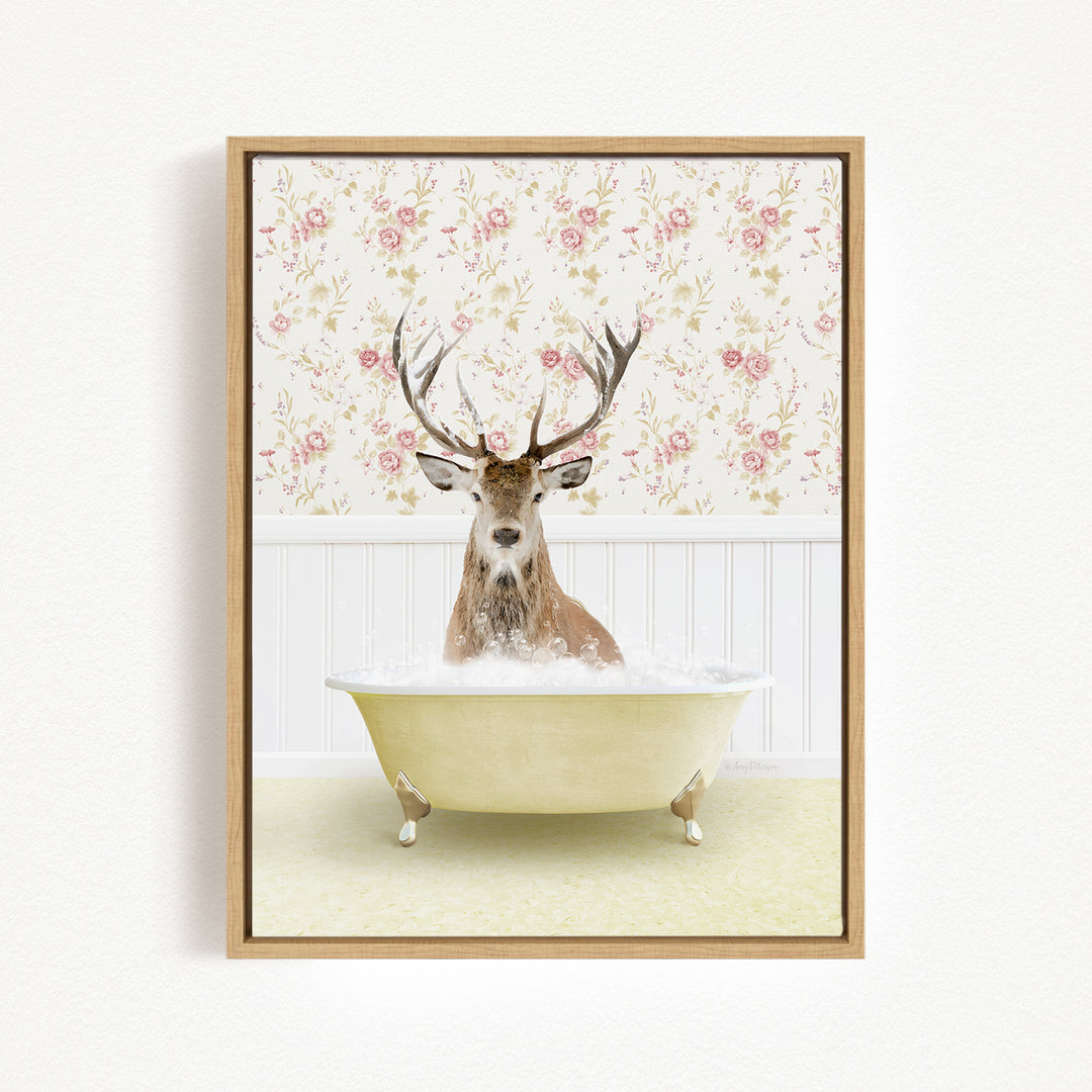 A deer with antlers is sitting in a bathtub filled with bubbles, surrounded by a floral wallpaper.