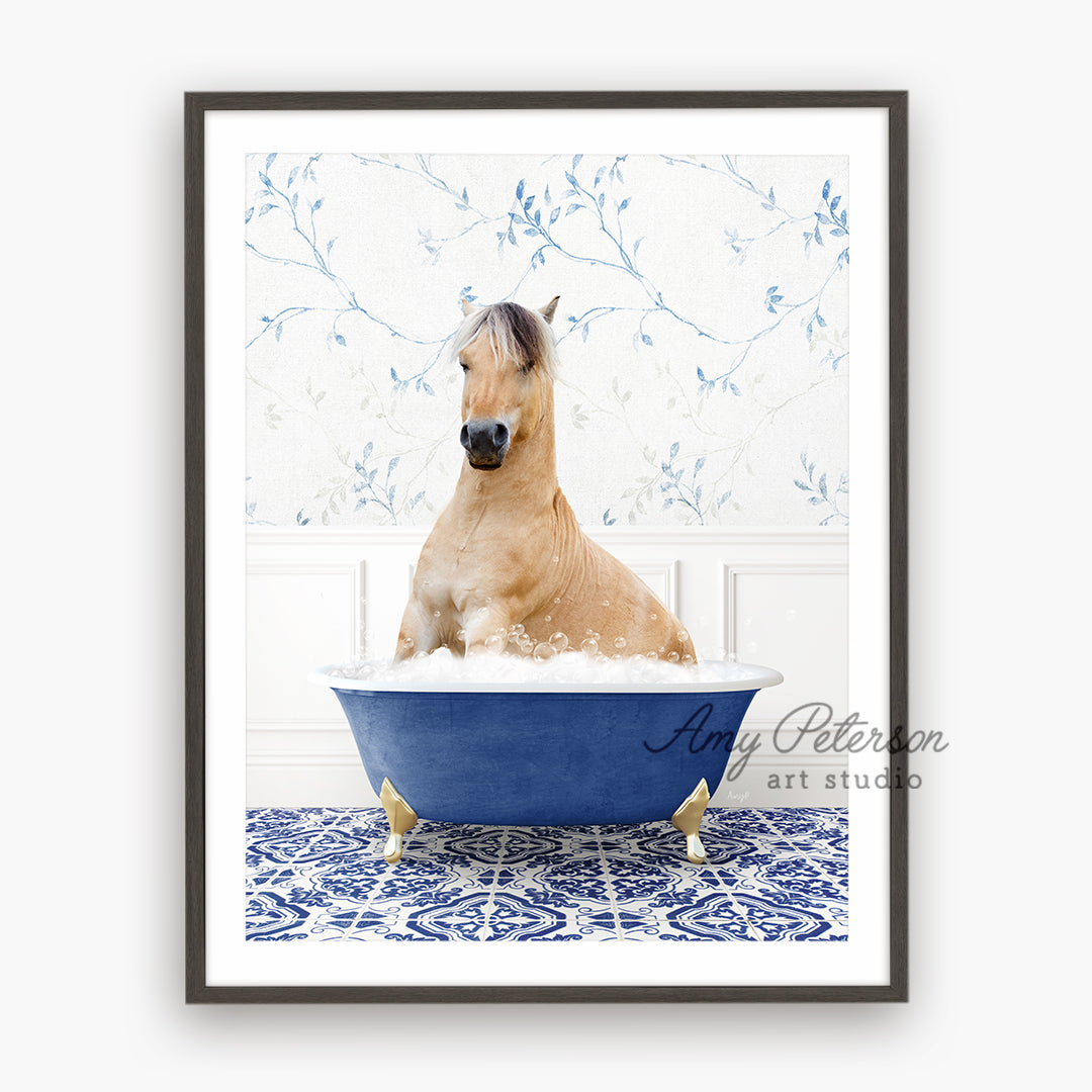 a brown horse sitting in a blue bath tub