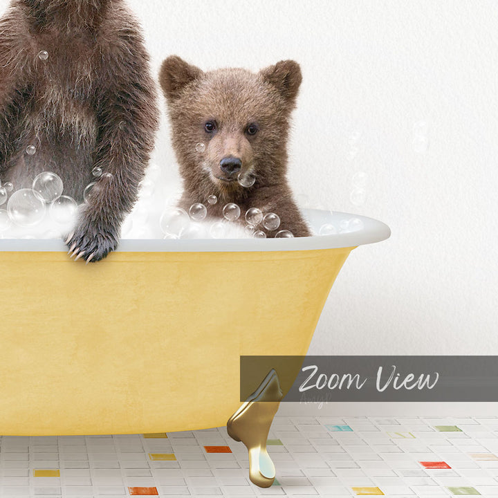 A young bear cub sitting in a yellow bathtub filled with bubbles, with a text overlay that reads "Zoom View".