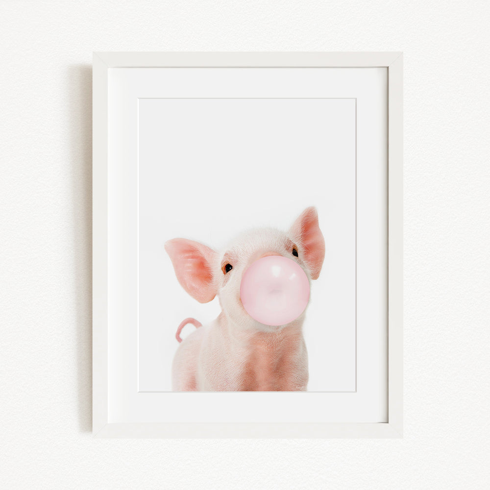 A cute pig blowing a bubble with a pink bubble gum bubble.