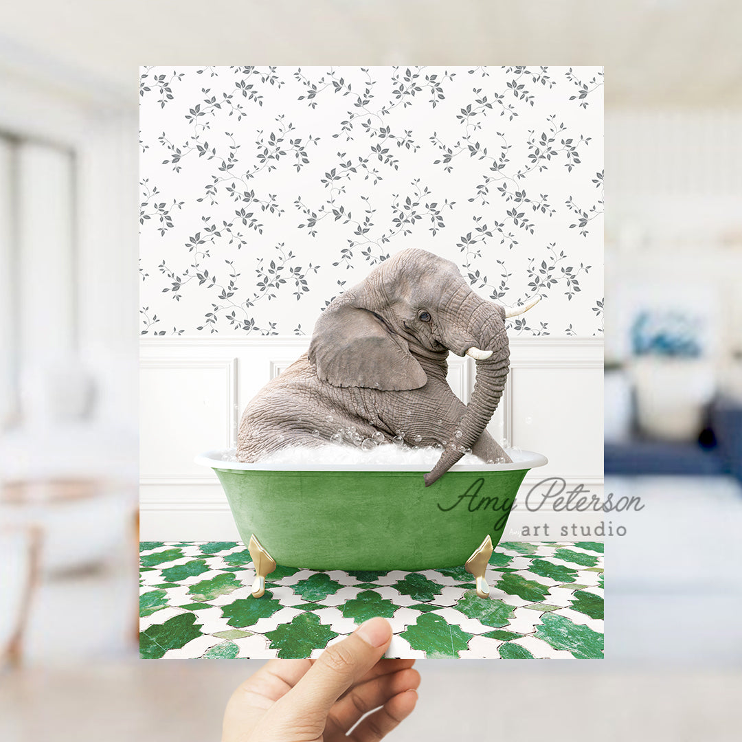 a person holding up a card with an elephant in a bathtub