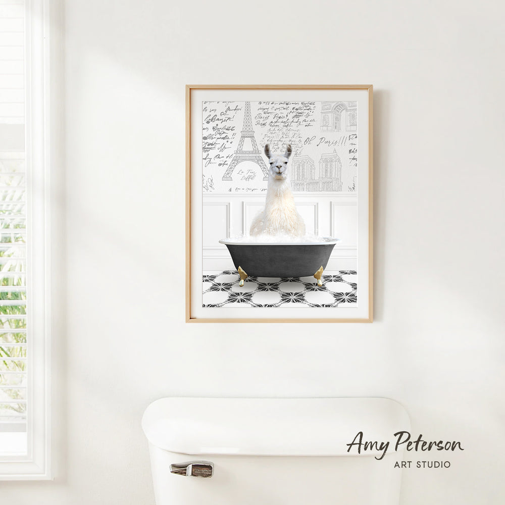 A framed image of a white llama sitting in a bathtub, with a black and white checkered floor and a drawing of the Eiffel Tower in the background.