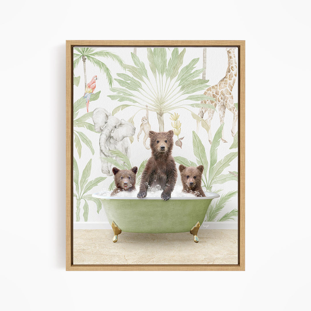 A framed print depicting three bears sitting in a green bathtub, surrounded by tropical foliage and animals.