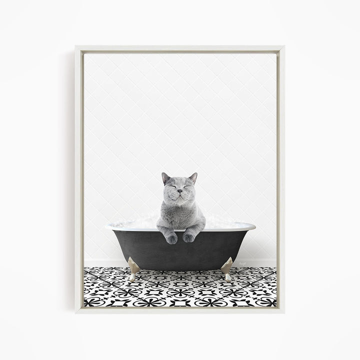 A gray cat sitting in a bathtub filled with bubbles, looking relaxed and content.