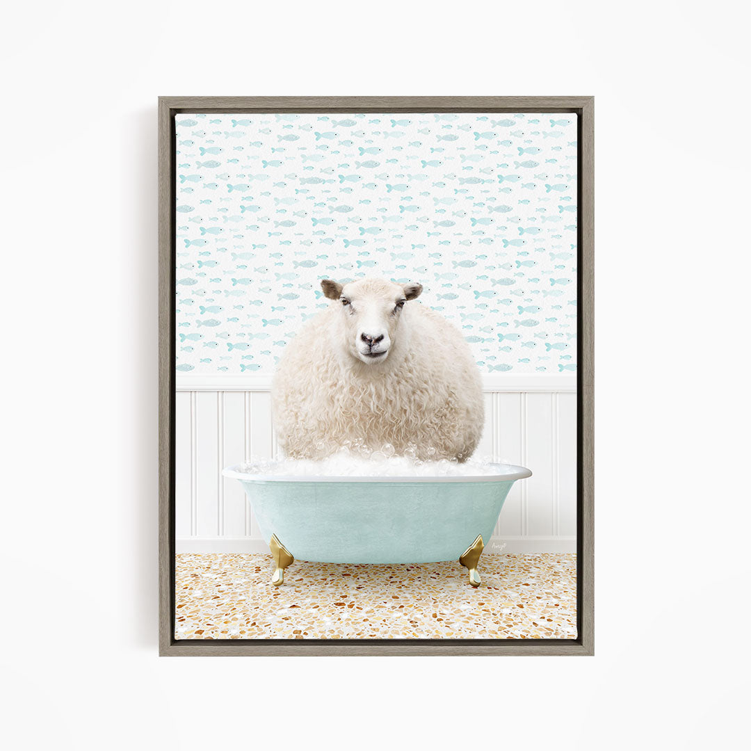 A fluffy white sheep sits in a blue bathtub filled with bubbles, surrounded by a patterned wallpaper.
