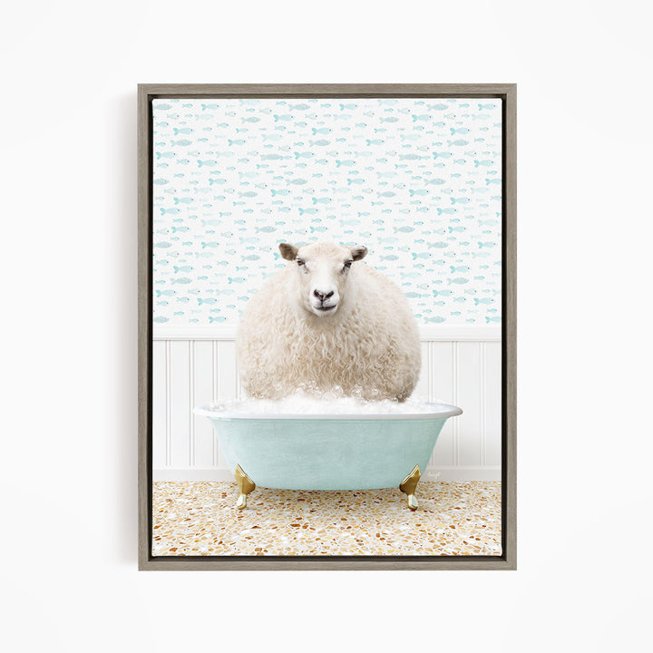 A fluffy white sheep sits in a blue bathtub filled with bubbles, surrounded by a patterned wallpaper.