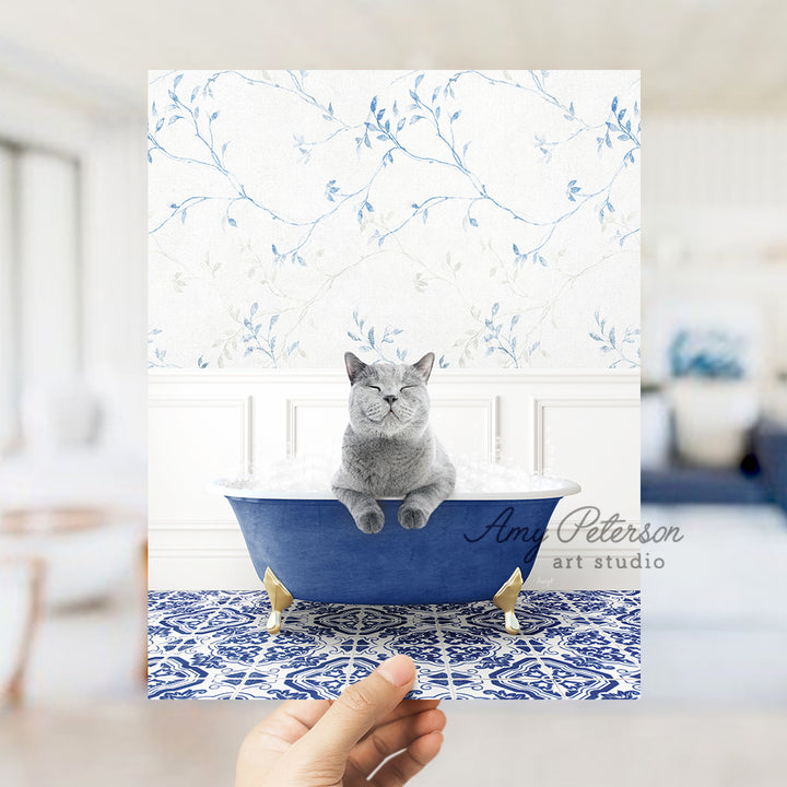 a person holding a card with a cat in a bathtub