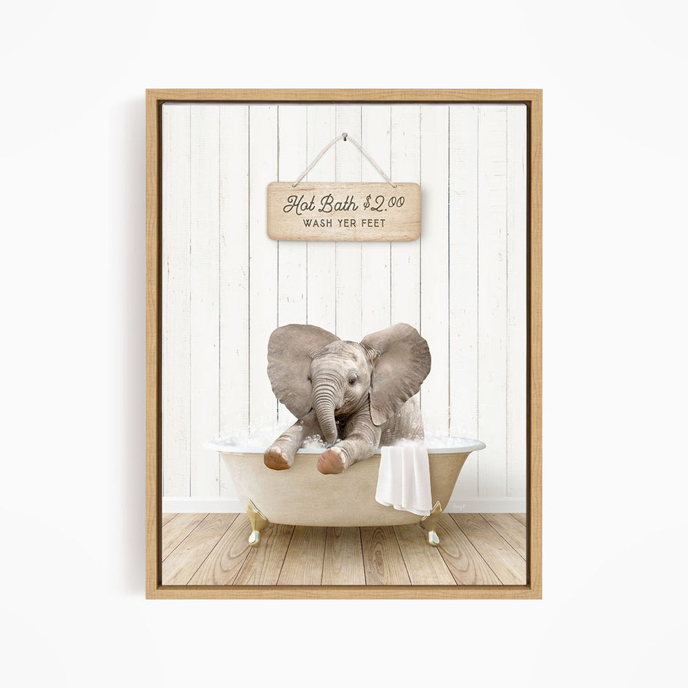 A wooden bathtub with a baby elephant sitting in it, and a sign above the bathtub that reads "Hot Bath $2.00 WASH YOUR FEET".