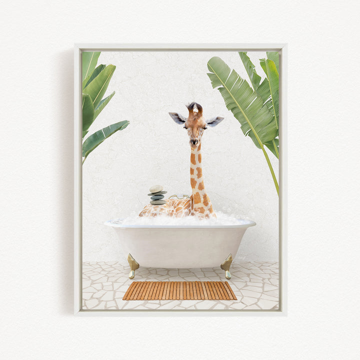 A giraffe is sitting in a bathtub filled with water, surrounded by tropical plants.