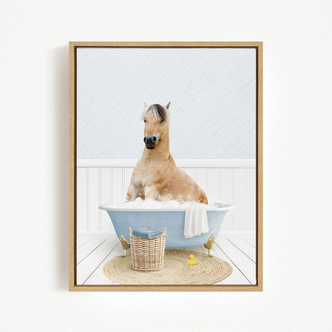 A brown horse sitting in a blue bathtub filled with water, surrounded by a basket and a yellow rubber duck.