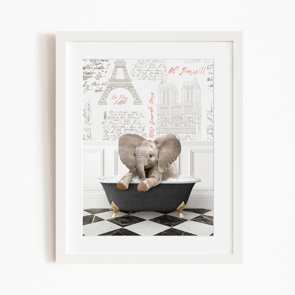 A framed image depicting a baby elephant sitting in a bathtub, with a Paris-themed background featuring the Eiffel Tower and other Parisian landmarks.