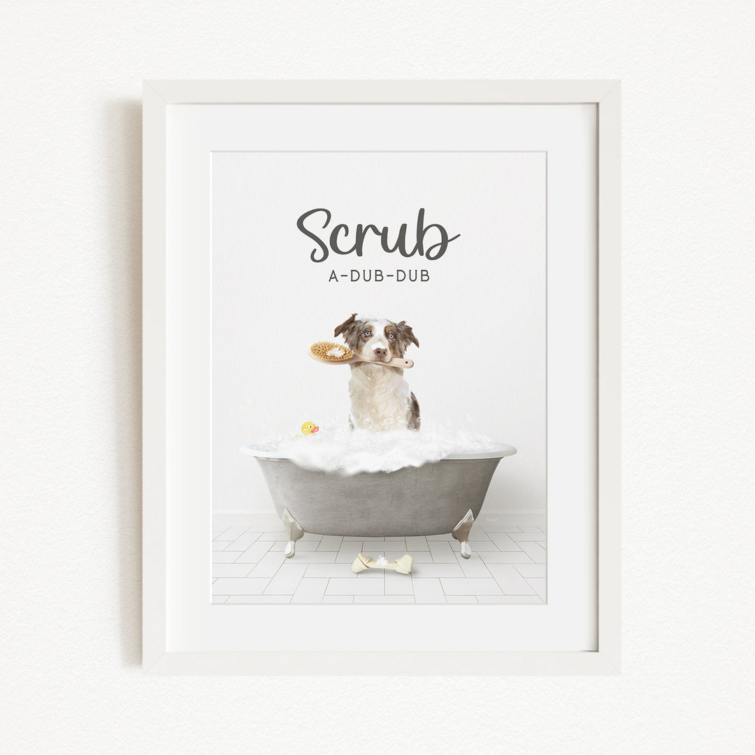 A dog sitting in a bathtub, holding a toy in its mouth, with the text "Scrub A-DUB-DUB" above the image.