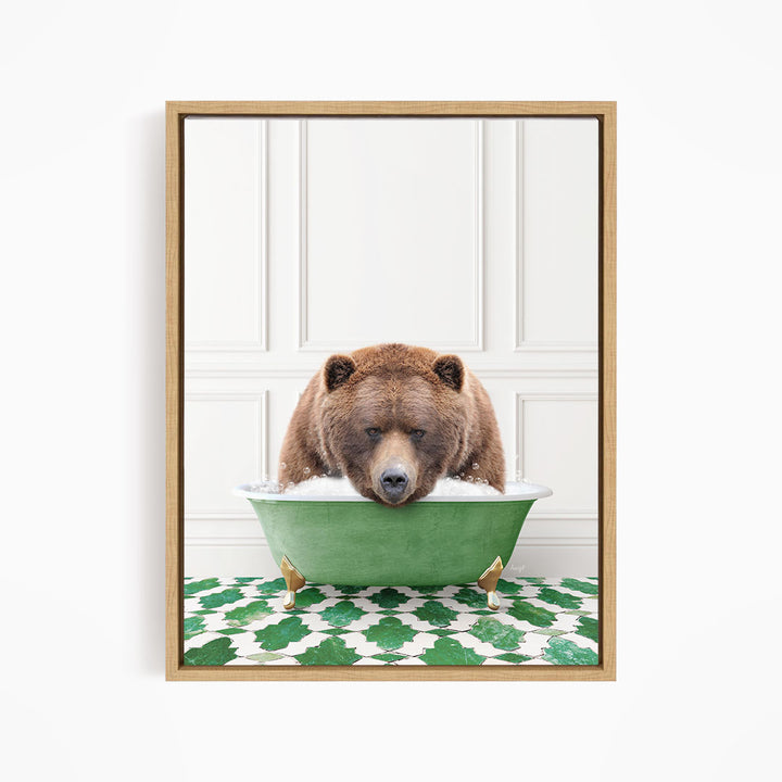 A brown bear is sitting in a green bathtub, appearing to be enjoying a bath.
