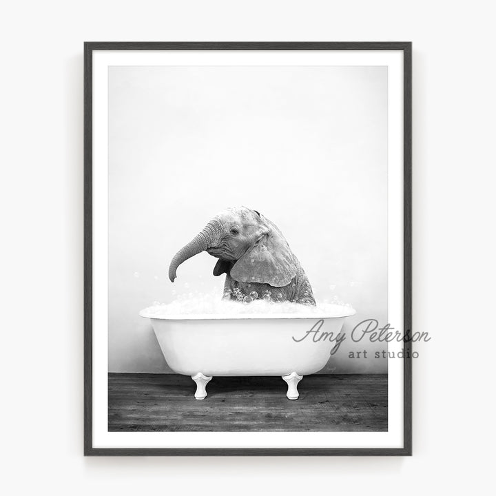 a black and white photo of an elephant in a bathtub