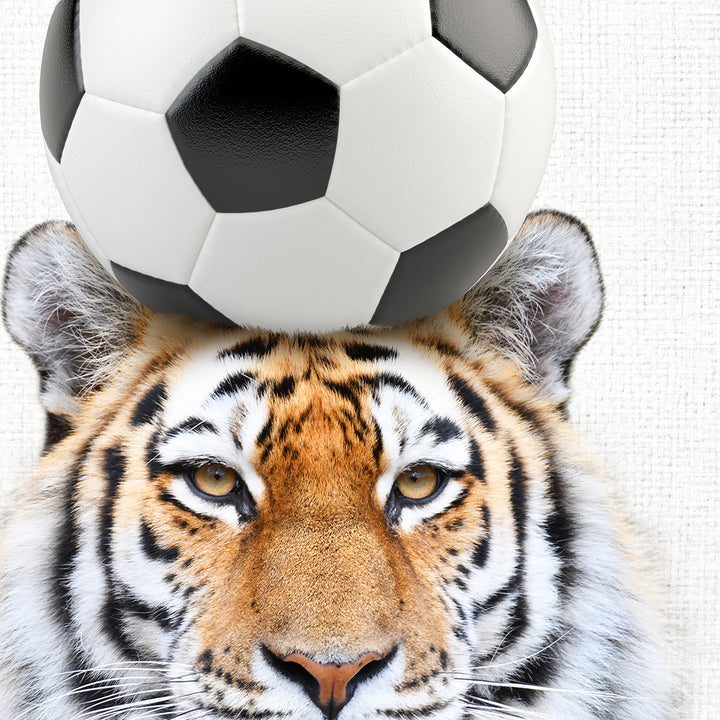 a tiger with a soccer ball on its head