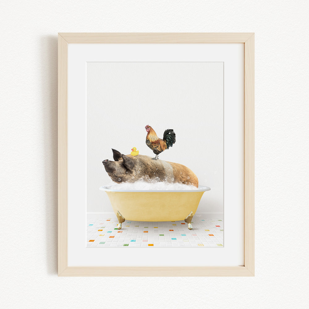 A framed image depicting a pig sitting in a yellow bathtub, with a rooster perched on its head, and a yellow rubber duck floating on the water.