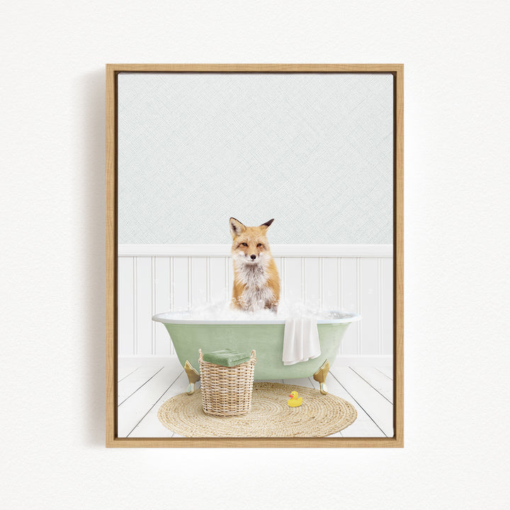 A fox is sitting in a green bathtub filled with bubbles, surrounded by a basket of toys and a yellow rubber duck.