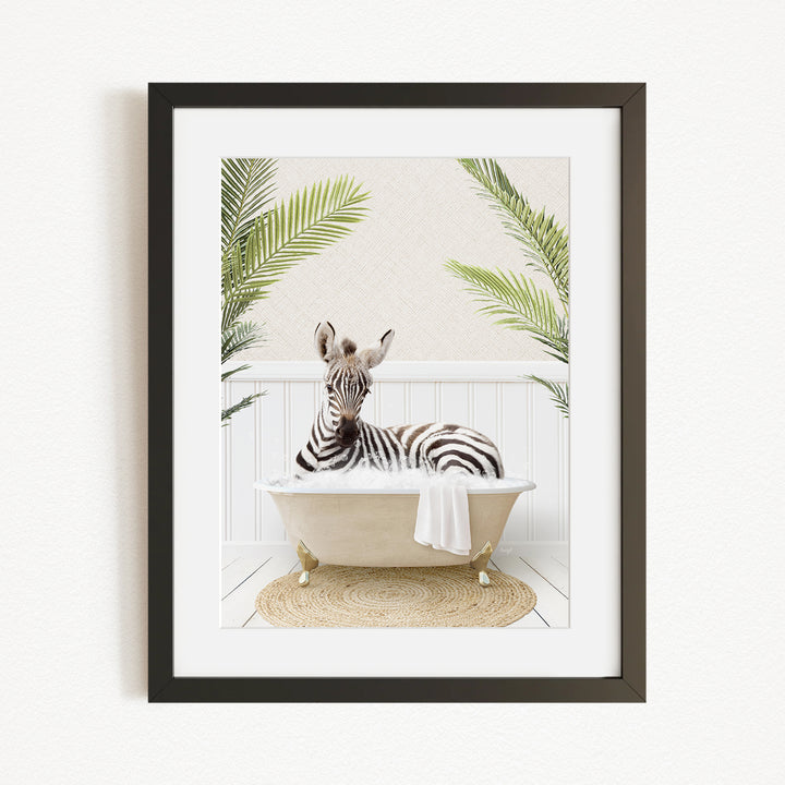 A zebra is sitting in a bathtub filled with water, surrounded by green palm leaves, creating a whimsical and playful scene.