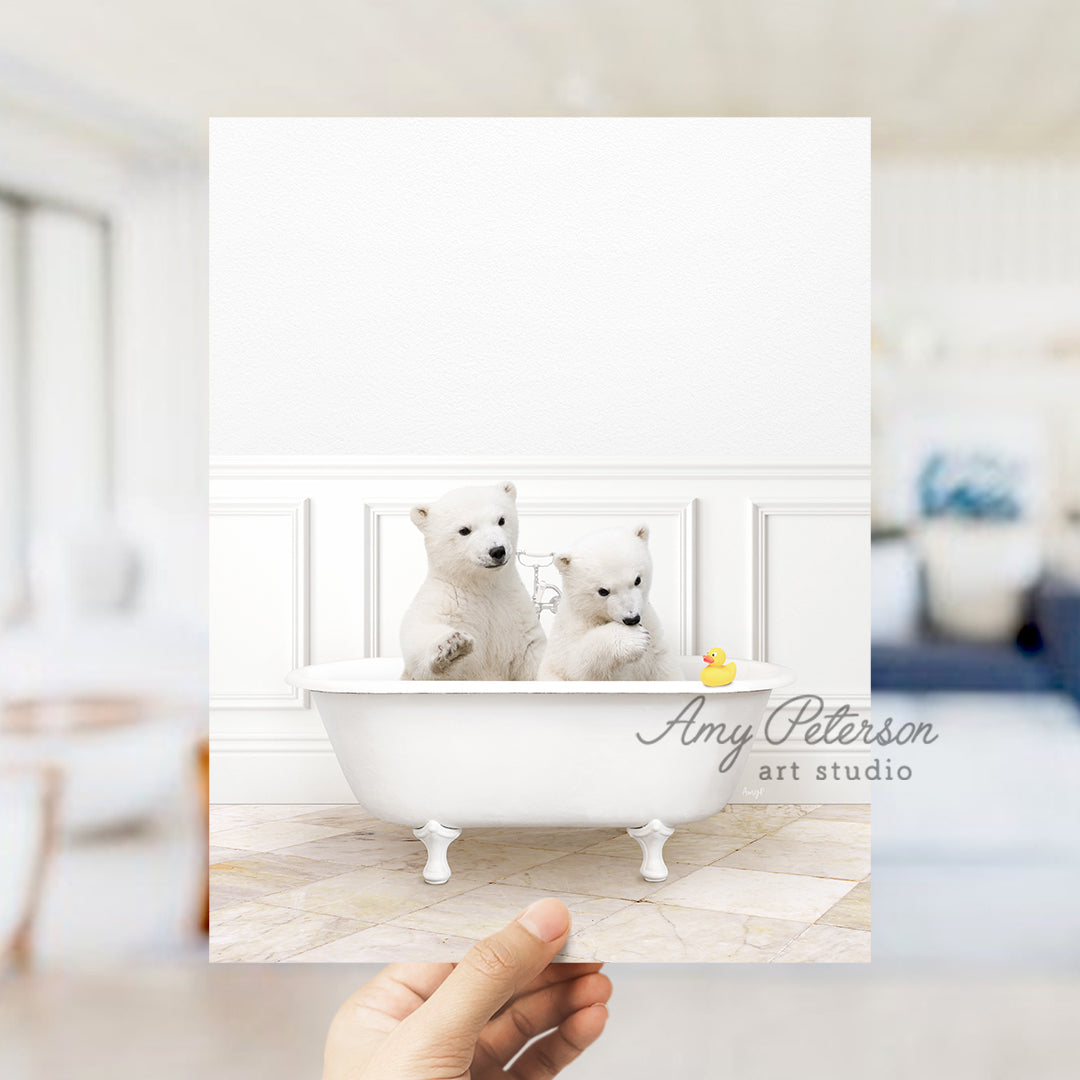 a person holding up a card with two white dogs in a bathtub