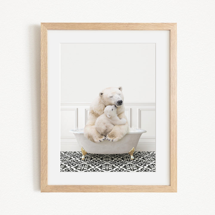 A polar bear and its cub sitting in a bathtub, with the bear appearing to be hugging the cub.