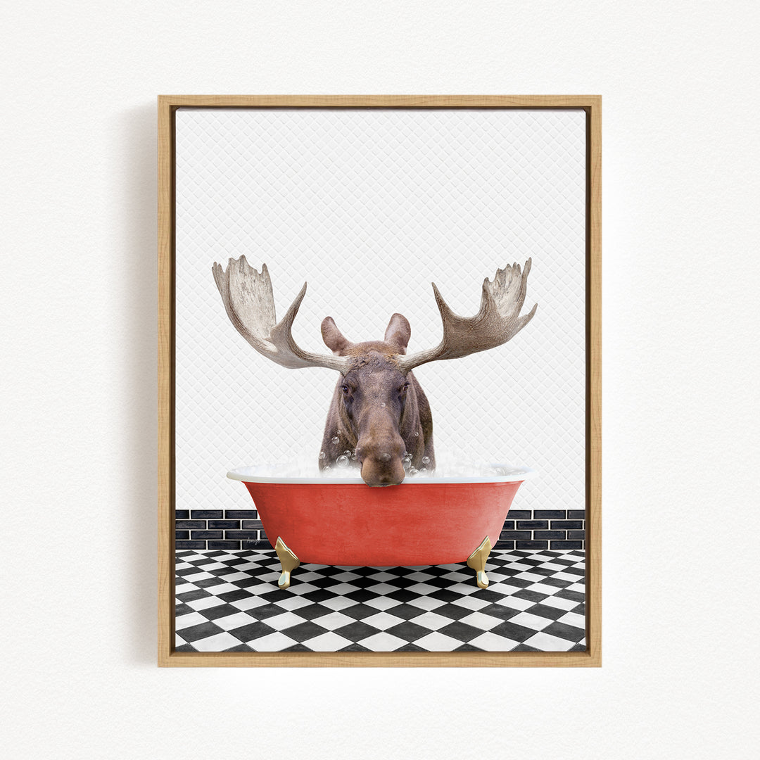 A moose with large antlers is sitting in a red bathtub, surrounded by a black and white checkered floor.