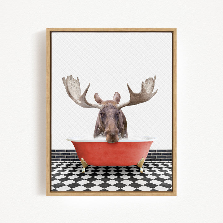A moose with large antlers is sitting in a red bathtub, surrounded by a black and white checkered floor.