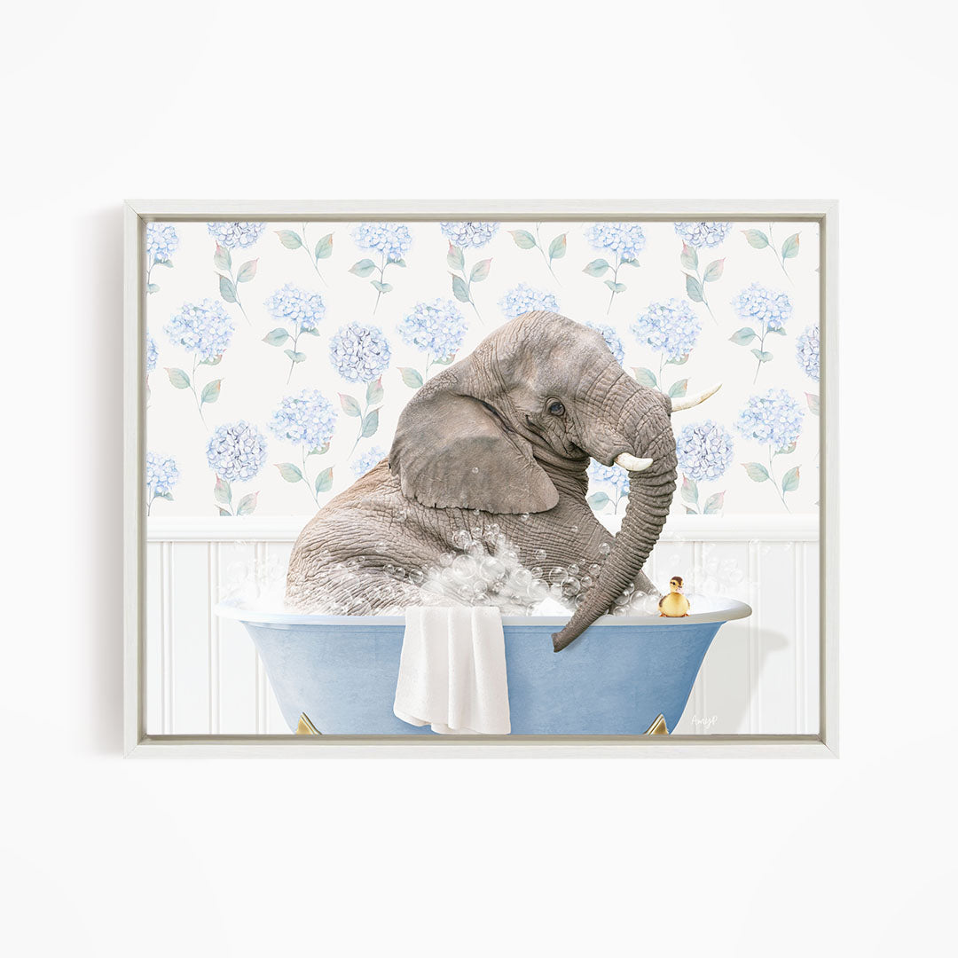 A gray elephant is sitting in a blue bathtub filled with water, surrounded by blue hydrangea flowers.