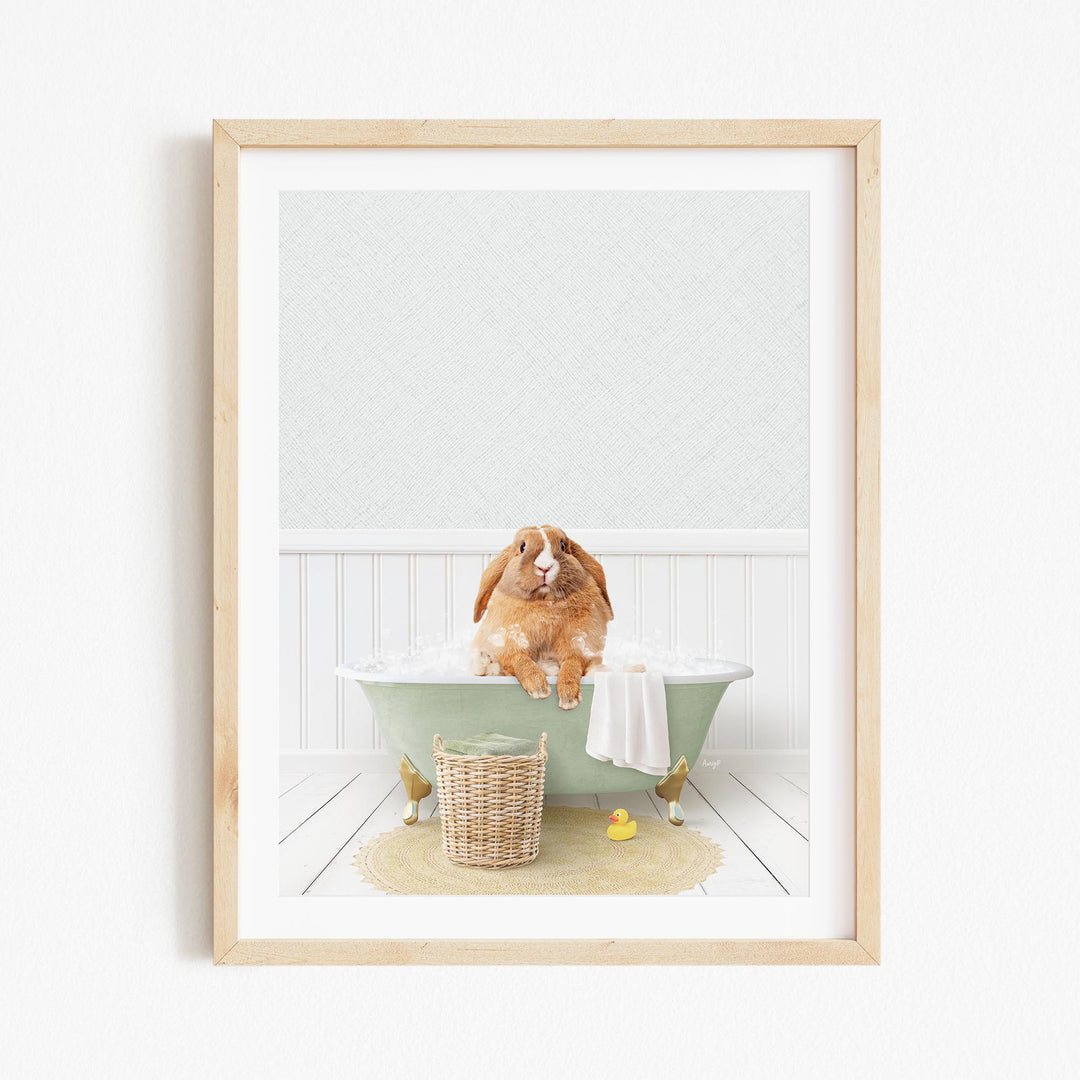 A brown rabbit sitting in a green bathtub filled with bubbles, surrounded by a yellow rubber duck and a wicker basket.