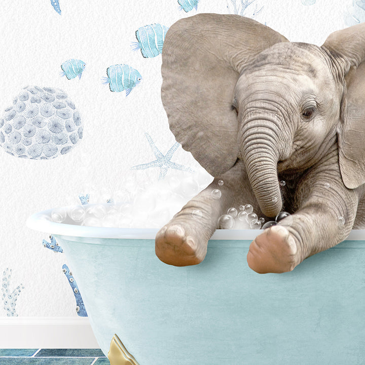 a baby elephant in a bath tub with bubbles