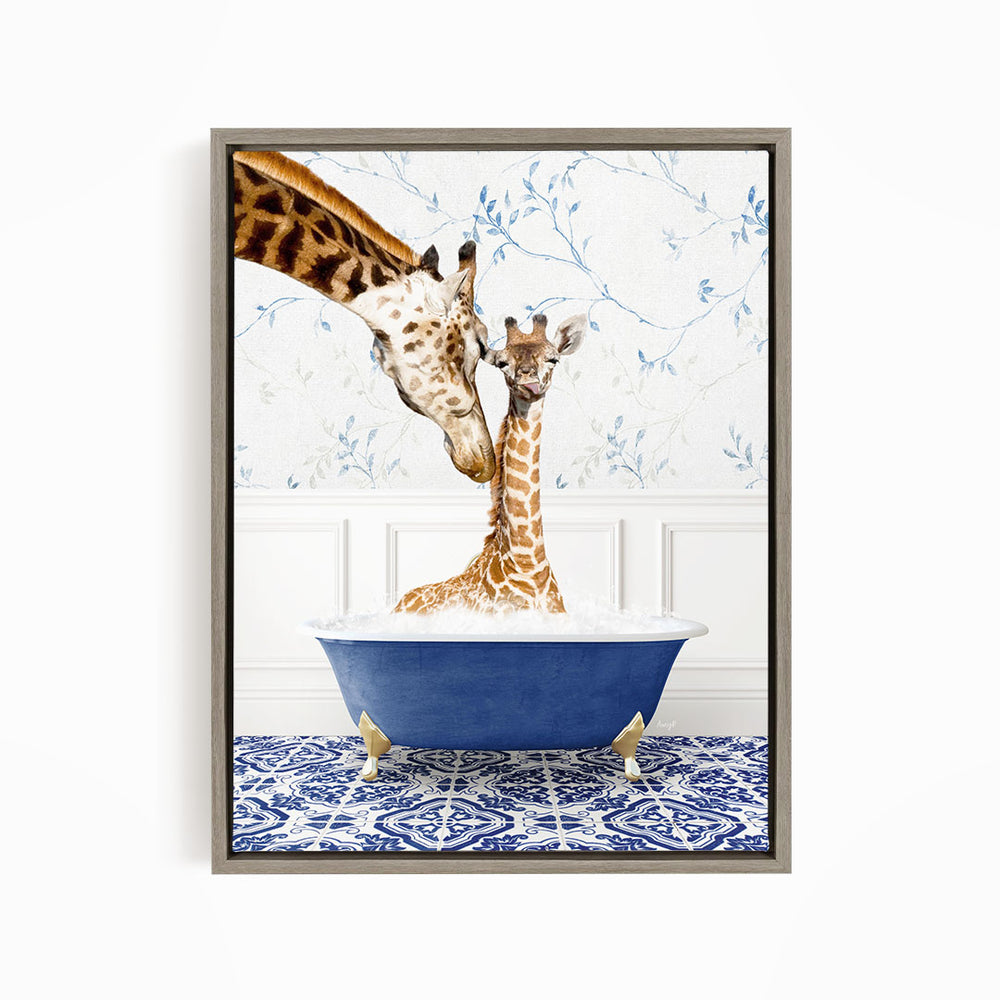 A giraffe and a baby giraffe are sitting in a blue bathtub, with the baby giraffe being gently cleaned by the adult giraffe.